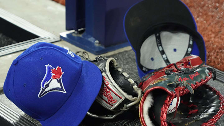 A pair of Toronto Blue Jays hats and gloves in the dugout during the first inning against the Los Angeles Dodgers at Rogers Centre on April 27. A pair of Toronto Blue Jays hats and gloves in the dugout during the first inning against the Los Angeles Dodgers at Rogers Centre on April 27.