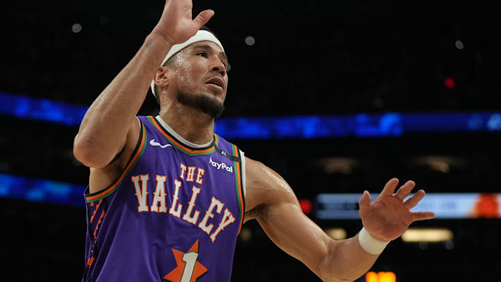 Mar 30, 2025; Phoenix, Arizona, USA; Phoenix Suns guard Devin Booker (1) hustles after the ball against the Houston Rockets in the first half at Footprint Center. Mandatory Credit: Rick Scuteri-Imagn Images