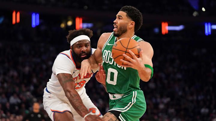 Celtics forward Jayson Tatum drives against Knicks center Mitchell Robinson on Thursday.