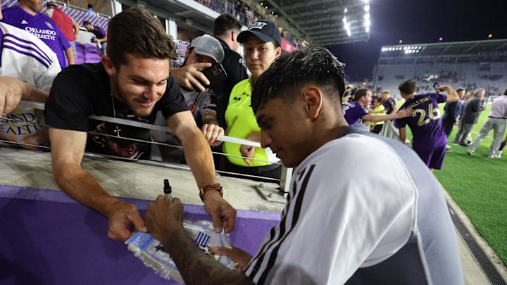 Feb 25, 2023; Orlando, Florida, USA; Orlando City SC midfielder Facundo Torres (17) signs autographs