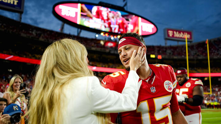 Oct 12, 2025; Kansas City, Missouri, USA; Brittany Mahomes and Kansas City Chiefs quarterback Patrick Mahomes (15) prior to a game against the Detroit Lions at GEHA Field at Arrowhead Stadium. Mandatory Credit: Jay Biggerstaff-Imagn Images