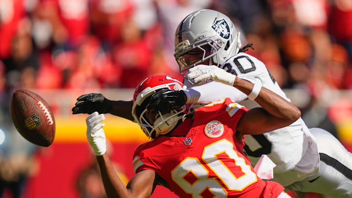 Oct 19, 2025; Kansas City, Missouri, USA; Las Vegas Raiders cornerback Darnay Holmes (30) breaks up a pass intended for Kansas City Chiefs wide receiver Tyquan Thornton (80) during the second quarter of the game at GEHA Field at Arrowhead Stadium. Mandatory Credit: Jay Biggerstaff-Imagn Images Oct 19, 2025; Kansas City, Missouri, USA; Las Vegas Raiders cornerback Darnay Holmes (30) breaks up a pass intended for Kansas City Chiefs wide receiver Tyquan Thornton (80) during the second quarter of the game at GEHA Field at Arrowhead Stadium. Mandatory Credit: Jay Biggerstaff-Imagn Images