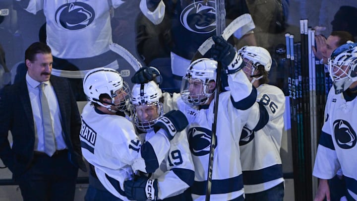Penn State Nittany Lions forward Dane Dowiak (19) celebrates a goal in the second period of a game against the Clarkson Golden Knights at Pegula Ice Arena. 