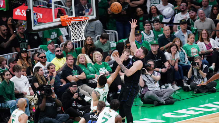 Jun 6, 2024; Boston, Massachusetts, USA; Dallas Mavericks guard Luka Doncic (77) shoots against Boston Celtics forward Jayson Tatum (0) in the second quarter during game one of the 2024 NBA Finals at TD Garden. Mandatory Credit: David Butler II-USA TODAY Sports Jun 6, 2024; Boston, Massachusetts, USA; Dallas Mavericks guard Luka Doncic (77) shoots against Boston Celtics forward Jayson Tatum (0) in the second quarter during game one of the 2024 NBA Finals at TD Garden. Mandatory Credit: David Butler II-USA TODAY Sports