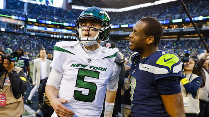 Jan 1, 2023; Seattle, Washington, USA; Seattle Seahawks quarterback Geno Smith (7) talks with New York Jets quarterback Mike White (5) following a 23-6 Seattle victory at Lumen Field. Mandatory Credit: Joe Nicholson-Imagn Images Jan 1, 2023; Seattle, Washington, USA; Seattle Seahawks quarterback Geno Smith (7) talks with New York Jets quarterback Mike White (5) following a 23-6 Seattle victory at Lumen Field. Mandatory Credit: Joe Nicholson-Imagn Images