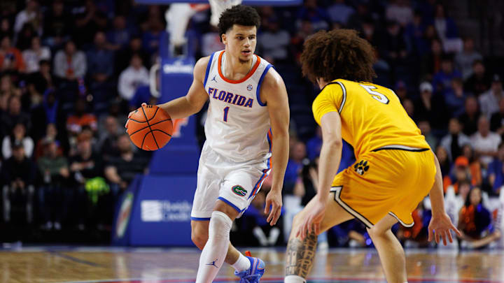 Jan 14, 2025; Gainesville, Florida, USA; Florida Gators guard Walter Clayton Jr. (1) dribbles the ball at Missouri Tigers guard T.O. Barrett (5) during the second half at Exactech Arena at the Stephen C. O'Connell Center. Mandatory Credit: Matt Pendleton-Imagn Images