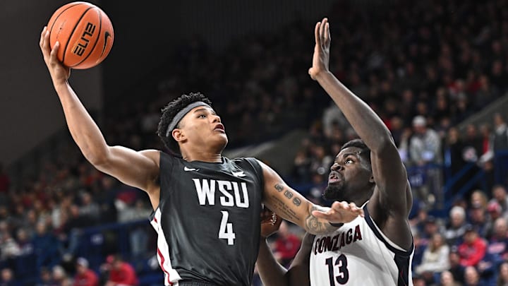 Jan 11, 2025; Spokane, Washington, USA; Washington State Cougars forward LeJuan Watts (4) shoots the ball against Gonzaga Bulldogs forward Graham Ike (13) in the second half at McCarthey Athletic Center. Mandatory Credit: James Snook-Imagn Images