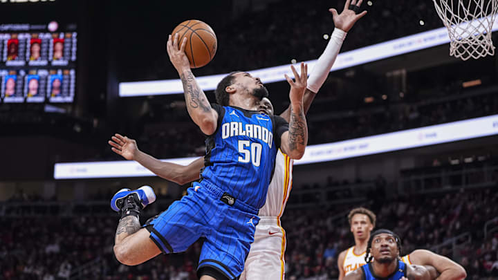 Orlando Magic guard Cole Anthony (50) looks for a shot against the Atlanta Hawks during the first half at State Farm Arena. Orlando Magic guard Cole Anthony (50) looks for a shot against the Atlanta Hawks during the first half at State Farm Arena.