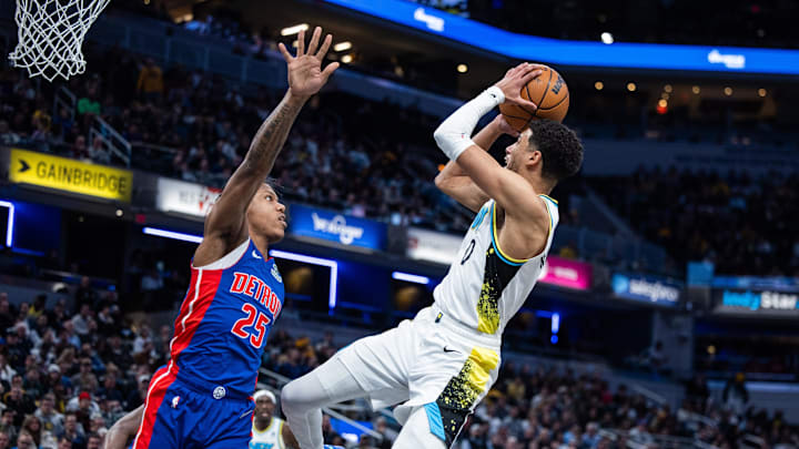 Jan 29, 2025; Indianapolis, Indiana, USA; Indiana Pacers guard Tyrese Haliburton (0) shoots the ball while Detroit Pistons guard Marcus Sasser (25) defends in the first half at Gainbridge Fieldhouse. Mandatory Credit: Trevor Ruszkowski-Imagn Images
