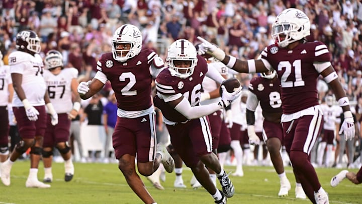 Oct 19, 2024; Starkville, Mississippi, USA; Mississippi State Bulldogs linebacker Zakari Tillman (16) reacts with teammates after an interception against the Texas A&M Aggies during the fourth quarter at Davis Wade Stadium at Scott Field. Mandatory Credit: Matt Bush-Imagn Images