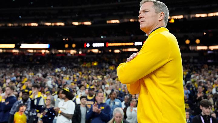 Michigan head coach Dusty May looks on from the court ahead of the NCAA National Championship game against Connecticut at Lucas Oil Stadium in Indianapolis on Monday, April 6, 2026.