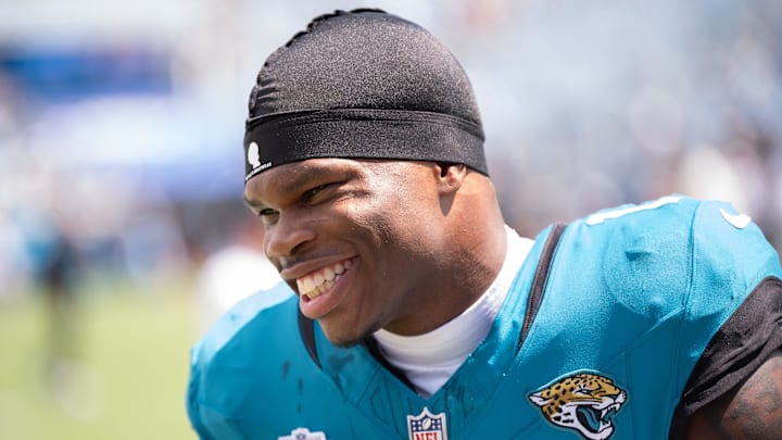 Jacksonville Jaguars wide receiver Travis Hunter (12) has a laugh while warming up before the start of an NFL football game between the Carolina Panthers at Jacksonville Jaguars at EverBank Stadium Sunday September 7, 2025. [Doug Engle/Florida Times-Union]