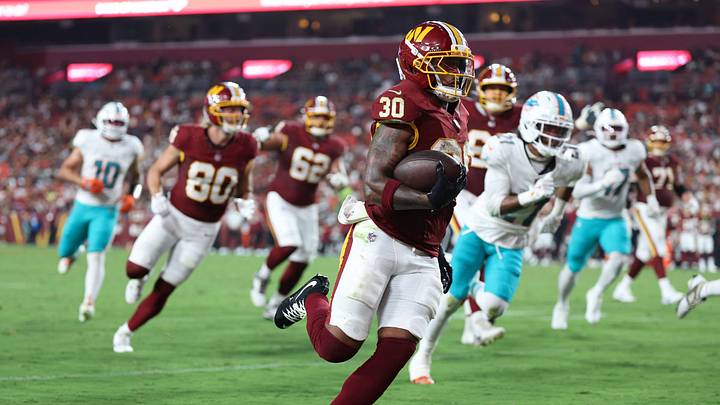Aug 14, 2026; Landover, Maryland, USA; Washington Commanders running back Robert Henry Jr. (30) carries the ball to score a touchdown against the Miami Dolphins during the first half at Northwest Stadium. Mandatory Credit: Amber Searls-Imagn Images Aug 14, 2026; Landover, Maryland, USA; Washington Commanders running back Robert Henry Jr. (30) carries the ball to score a touchdown against the Miami Dolphins during the first half at Northwest Stadium. Mandatory Credit: Amber Searls-Imagn Images