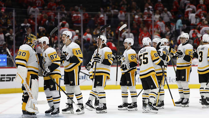 Nov 8, 2024; Washington, District of Columbia, USA; Pittsburgh Penguins goaltender Joel Blomqvist (30) celebrates with teammates after their game against the Washington Capitals at Capital One Arena. Mandatory Credit: Geoff Burke-Imagn Images