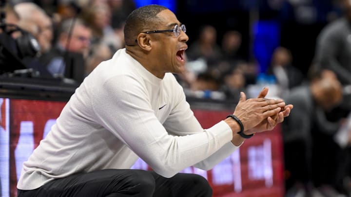 Mar 12, 2025; Nashville, TN, USA;  Texas Longhorns head coach Rodney Terry cheers his team on against the Vanderbilt Commodores during the second half at Bridgestone Arena. Mandatory Credit: Steve Roberts-Imagn Images