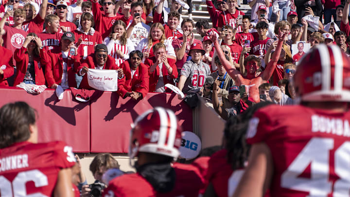 Oct 19, 2024; Bloomington, Indiana, USA; Fans celebrate a victory with members of the Indiana Hoosiers after beating the Nebraska Cornhuskers at Memorial Stadium. Mandatory Credit: Jacob Musselman-Imagn Images