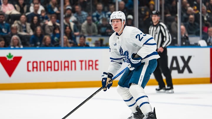 Jan 31, 2026; Vancouver, British Columbia, CAN; Toronto Maple Leafs defenseman Brandon Carlo (25) handles the puck against the Vancouver Canucks in the first period at Rogers Arena. Mandatory Credit: Bob Frid-Imagn Images