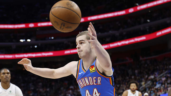Feb 25, 2026; Detroit, Michigan, USA; Oklahoma City Thunder guard Nikola Topic (44) goes for the rebound in the second half against the Detroit Pistons at Little Caesars Arena.