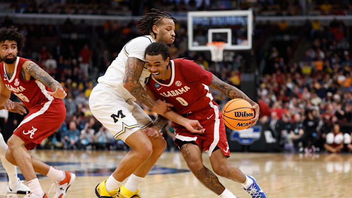 Mar 27, 2026; Chicago, IL, USA; Alabama Crimson Tide guard Labaron Philon Jr. (0) drives against Michigan Wolverines guard Roddy Gayle Jr. (11) in the first half during a Sweet Sixteen game of the Midwest Regional of the men's 2026 NCAA Tournament at United Center. Mandatory Credit: Kamil Krzaczynski-Imagn Images
