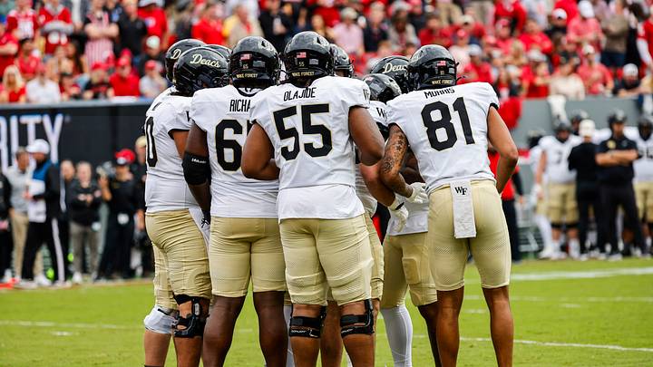 Oct 10, 2026; Raleigh, North Carolina, USA; Wake Forest Demon Deacons offensive players huddle during the first half of the game against NC State Wolfpack at Carter-Finley Stadium. Mandatory Credit: Jaylynn Nash-Imagn Images Oct 10, 2026; Raleigh, North Carolina, USA; Wake Forest Demon Deacons offensive players huddle during the first half of the game against NC State Wolfpack at Carter-Finley Stadium. Mandatory Credit: Jaylynn Nash-Imagn Images