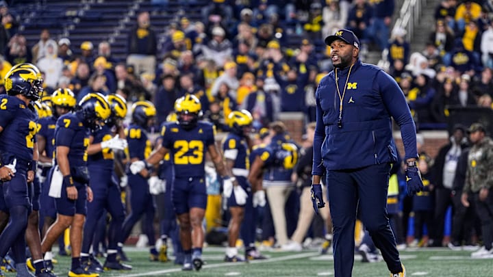 Michigan head coach Sherrone Moore watches warmup ahead of the Purdue game at Michigan Stadium in Ann Arbor on Saturday, November 1, 2025. Michigan head coach Sherrone Moore watches warmup ahead of the Purdue game at Michigan Stadium in Ann Arbor on Saturday, November 1, 2025.