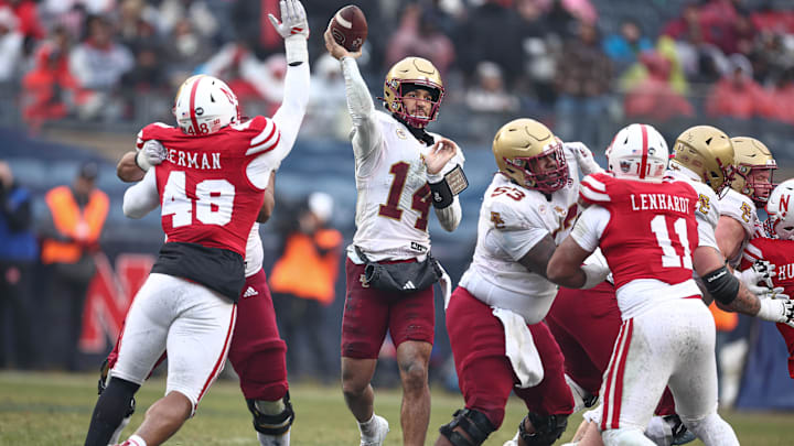 Dec 28, 2024; Bronx, NY, USA; Boston College Eagles quarterback Grayson James (14) throws the ball during the first half against the Nebraska Cornhuskers at Yankee Stadium. Mandatory Credit: Vincent Carchietta-Imagn Images