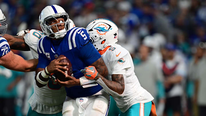 Oct 20, 2024; Indianapolis, Indiana, USA; Indianapolis Colts quarterback Anthony Richardson (5) is sacked by Miami Dolphins cornerback Jalen Ramsey (5) during the second half at Lucas Oil Stadium. Mandatory Credit: Marc Lebryk-Imagn Images Oct 20, 2024; Indianapolis, Indiana, USA; Indianapolis Colts quarterback Anthony Richardson (5) is sacked by Miami Dolphins cornerback Jalen Ramsey (5) during the second half at Lucas Oil Stadium. Mandatory Credit: Marc Lebryk-Imagn Images