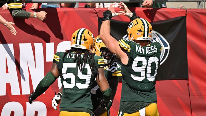 Oct 4, 2026; Tampa, Florida, USA;  Green Bay Packers linebacker Ty'ron Hopper (59) and defensive end Brenton Cox Jr. (57) and defensive end Lukas Van Ness (90) celebrate during the game against the Tampa Bay Buccaneers at Raymond James Stadium.  Mandatory Credit: Jonathan Dyer-Imagn Images