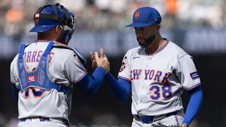 Apr 5, 2026; San Francisco, California, USA; New York Mets catcher Luis Torrens (13) and New York Mets pitcher Devin Williams (38) celebrate their 5-2 victory over the San Francisco Giants at Oracle Park. Mandatory Credit: D. Ross Cameron-Imagn Images