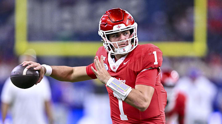 Dec 27, 2025; Houston, TX, USA; Houston Cougars quarterback Conner Weigman (1) warms up prior to the game against the Louisiana State Tigers at NRG Stadium. Mandatory Credit: Maria Lysaker-Imagn Images 