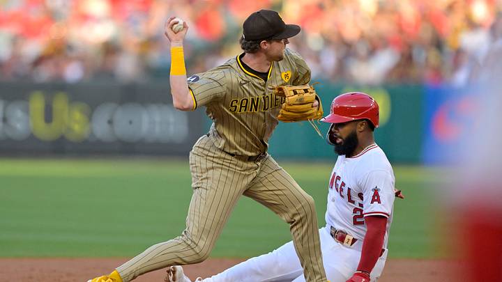Jun 4, 2024; Anaheim, California, USA; San Diego Padres first baseman Jake Cronenworth (9) throws to first as Los Angeles Angels second baseman Luis Rengifo (2) is out on a double play in the first inning at Angel Stadium. Mandatory Credit: Jayne Kamin-Oncea-USA TODAY Sports Jun 4, 2024; Anaheim, California, USA; San Diego Padres first baseman Jake Cronenworth (9) throws to first as Los Angeles Angels second baseman Luis Rengifo (2) is out on a double play in the first inning at Angel Stadium. Mandatory Credit: Jayne Kamin-Oncea-USA TODAY Sports