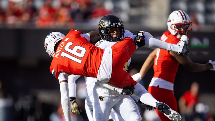 Oct 19, 2024; Tucson, Arizona, USA; Arizona Wildcats wide receiver Chris Hunter (16) is tackled by Colorado Buffaloes cornerback Colton Hood (3) at Arizona Stadium. Mandatory Credit: Mark J. Rebilas-Imagn Images Oct 19, 2024; Tucson, Arizona, USA; Arizona Wildcats wide receiver Chris Hunter (16) is tackled by Colorado Buffaloes cornerback Colton Hood (3) at Arizona Stadium. Mandatory Credit: Mark J. Rebilas-Imagn Images