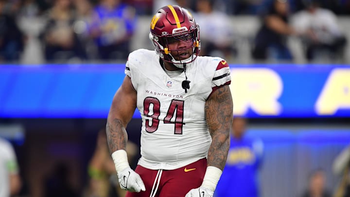 Dec 17, 2023; Inglewood, California, USA; Washington Commanders defensive tackle Daron Payne (94) reacts after sacking Los Angeles Rams quarterback Matthew Stafford (9) during the second half at SoFi Stadium. Mandatory Credit: Gary A. Vasquez-Imagn Images