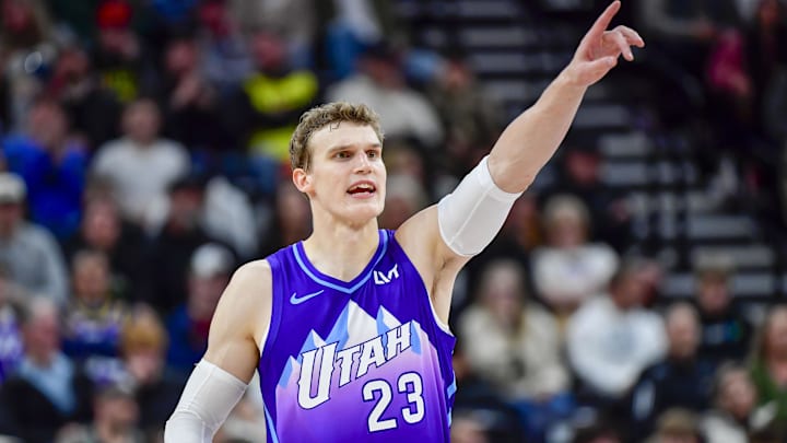 Nov 23, 2024; Salt Lake City, Utah, USA; Utah Jazz forward/center Lauri Markkanen (23) makes a call against the New York Knicks during the second half at the Delta Center. Mandatory Credit: Christopher Creveling-Imagn Images