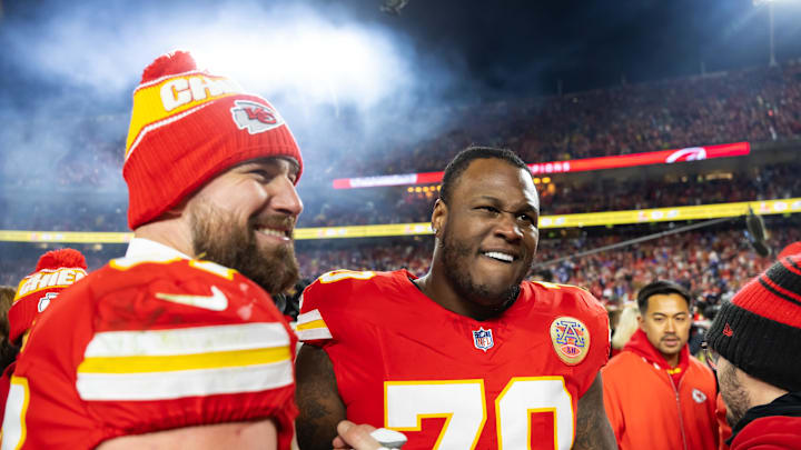 Jan 26, 2025; Kansas City, MO, USA; Kansas City Chiefs offensive tackle D.J. Humphries (70) and tight end Travis Kelce (87) celebrate after defeating the Buffalo Bills during the AFC Championship game at GEHA Field at Arrowhead Stadium. Mandatory Credit: Mark J. Rebilas-Imagn Images