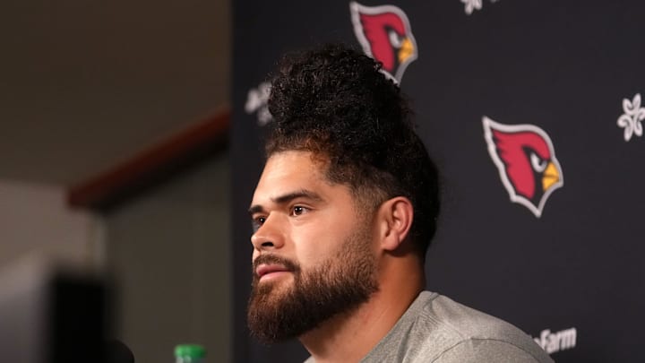 Arizona Cardinals newly signed free agent Isaac Seumalo speaks to the press at the Arizona Cardinals training facility in Tempe, on March 11, 2026.