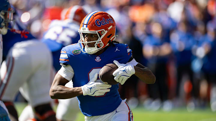 Nov 23, 2024; Gainesville, Florida, USA; Florida Gators wide receiver Elijhah Badger (6) rushes with the ball against the Mississippi Rebels during the first half at Ben Hill Griffin Stadium. Mandatory Credit: Matt Pendleton-Imagn Images