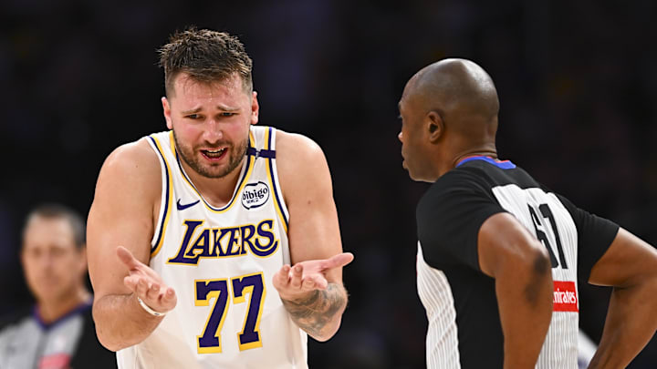 Mar 22, 2025; Los Angeles, California, USA; Los Angeles Lakers guard Luka Doncic (77) reacts to a call from referee Courtney Kirkland (61) against the Chicago Bulls during the second half at Crypto.com Arena. Mandatory Credit: Jonathan Hui-Imagn Images