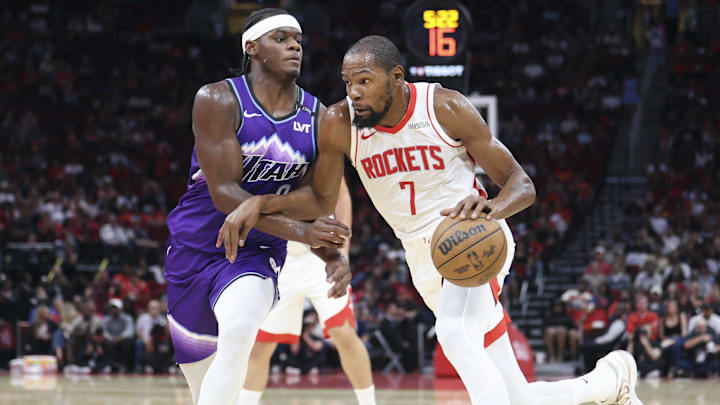 Oct 8, 2025; Houston, Texas, USA; Houston Rockets forward Kevin Durant (7) dribbles the ball as Utah Jazz forward Taylor Hendricks (0) defends during the third quarter at Toyota Center. Mandatory Credit: Troy Taormina-Imagn Images