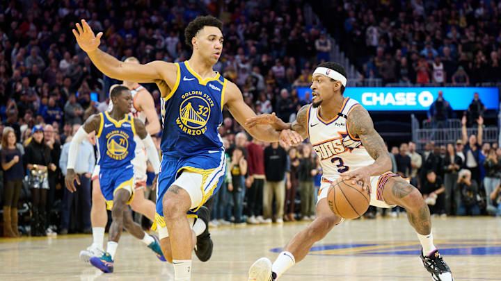 Dec 28, 2024; San Francisco, California, USA; Phoenix Suns guard Bradley Beal (3) dribbles the ball against Golden State Warriors forward Trayce Jackson-Davis (32) during the third quarter at Chase Center. Mandatory Credit: Robert Edwards-Imagn Images