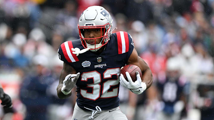 Sep 7, 2025; Foxborough, Massachusetts, USA; New England Patriots running back TreVeyon Henderson (32) rushes the ball against the Las Vegas Raiders in the first half at Gillette Stadium. Mandatory Credit: Brian Fluharty-Imagn Images