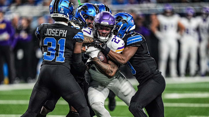 Minnesota Vikings running back Cam Akers (27) is stopped by Detroit Lions defense.