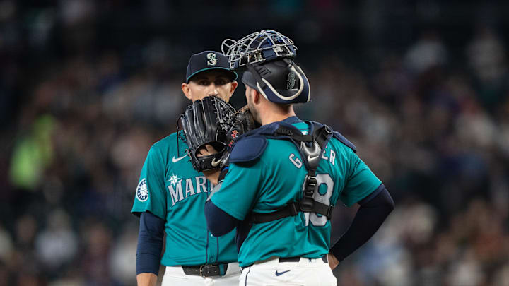 Seattle Mariners starting pitcher George Kirby (68) and catcher Mitch Garver (18) meet at the mound during a game against the San Francisco Giants at T-Mobile Park on Aug 24.