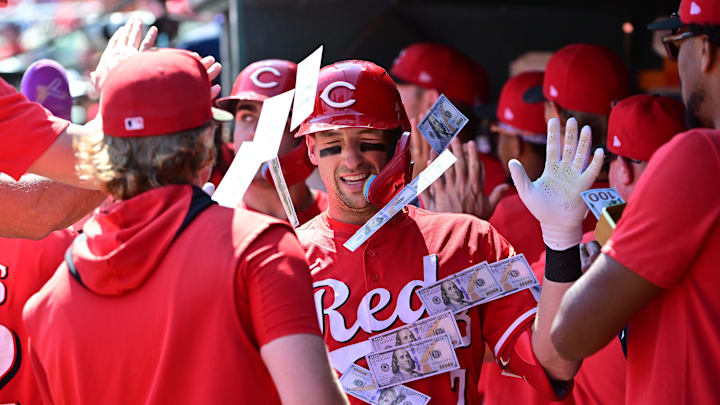 Sep 17, 2025; St. Louis, Missouri, USA; Cincinnati Reds teammates shower Cincinnati Reds first baseman Spencer Steer (7) with money in the dugout after he hit a three-run home run against the St. Louis Cardinals at Busch Stadium. Mandatory Credit: Tim Vizer-Imagn Images