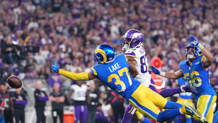 Jan 13, 2025; Glendale, AZ, USA; Los Angeles Rams safety Quentin Lake (37) dives attempting to make an interception against the Minnesota Vikings during the second half in an NFC wild card game at State Farm Stadium. Mandatory Credit: Joe Camporeale-Imagn Images