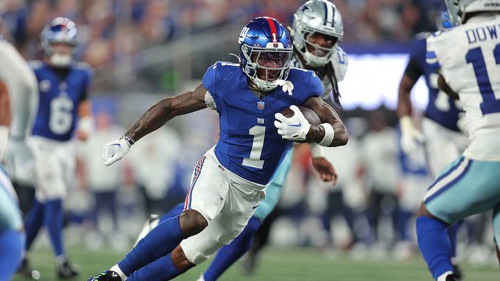 Sep 13, 2026; East Rutherford, New Jersey, USA;  New York Giants wide receiver Malik Nabers (1) carries the ball against the Dallas Cowboys during the third quarter at MetLife Stadium.  Mandatory Credit: Brad Penner-Imagn Images