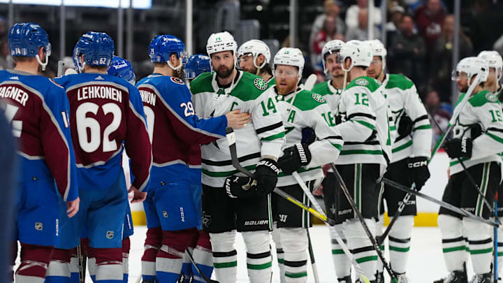 May 17, 2024; Denver, Colorado, USA; Dallas Stars left wing Jamie Benn (14) and Colorado Avalanche center Nathan MacKinnon (29) greet each other following a double overtime period in game six of the second round of the 2024 Stanley Cup Playoffs at Ball Arena. Mandatory Credit: Ron Chenoy-Imagn Images