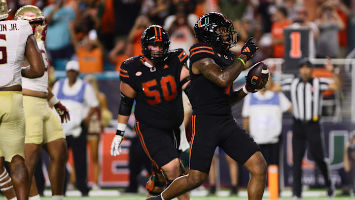 Oct 26, 2024; Miami Gardens, Florida, USA; Miami Hurricanes running back Mark Fletcher Jr. (4) reacts after scoring a touchdown against the Florida State Seminoles during the first quarter at Hard Rock Stadium. Mandatory Credit: Sam Navarro-Imagn Images