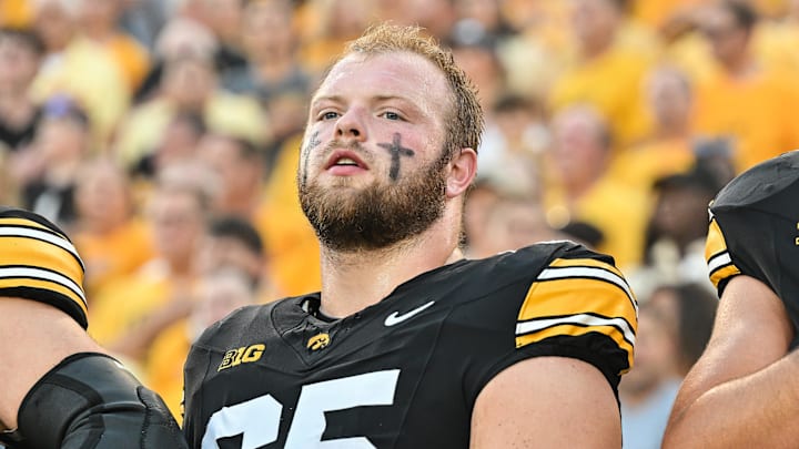 Sep 13, 2025; Iowa City, Iowa, USA; Iowa Hawkeyes offensive lineman Logan Jones (65) looks on before the game against the Massachusetts Minutemen at Kinnick Stadium. Mandatory Credit: Jeffrey Becker-Imagn Images Sep 13, 2025; Iowa City, Iowa, USA; Iowa Hawkeyes offensive lineman Logan Jones (65) looks on before the game against the Massachusetts Minutemen at Kinnick Stadium. Mandatory Credit: Jeffrey Becker-Imagn Images