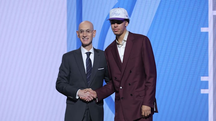 Jun 25, 2025; Brooklyn, NY, USA;  Will Riley stands with NBA commissioner Adam Silver after being selected as the 21st pick by the Utah Jazz in the first round of the 2025 NBA Draft at Barclays Center. Mandatory Credit: Brad Penner-Imagn Images